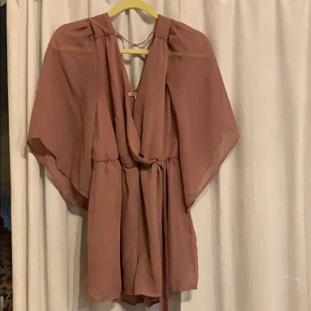 Blush colored romper with bell sleeves